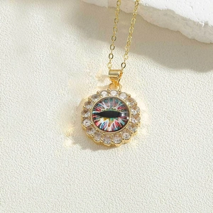 Macro detail of sun flower pendant with evil eye motif and white cubic zirconia accents