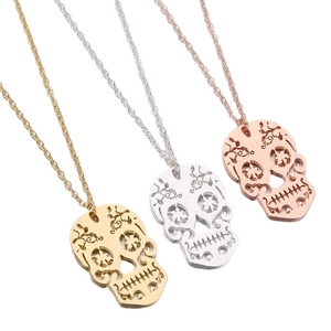 Vintage hollow skull pendant necklace set in gold, silver, and rose gold finishes