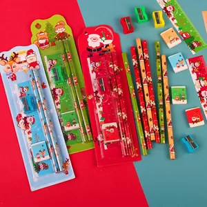 Christmas 5-piece stationery set with pencils, ruler and eraser on festive background