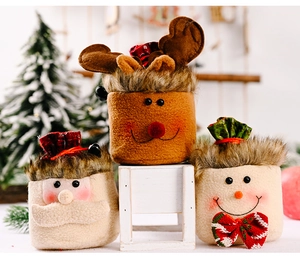 Plush Christmas gift bags featuring cartoon reindeer, Santa, and snowman characters