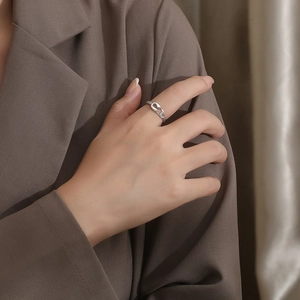 Close-up of minimalist silver paperclip ring worn on a finger for a stylish modern look