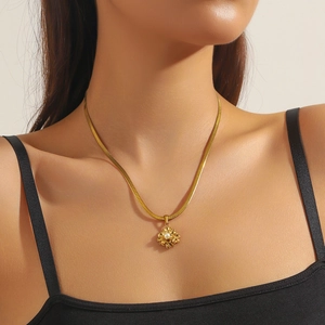 Gold-plated snake chain necklace with 3D flower pearl pendant on female model