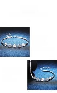 Detailed macro view of S925 silver four-leaf clover bracelet featuring Moissanite stones