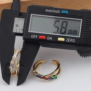 Detailed view of dual-layer crystal ring measuring 5.8mm with digital caliper tool