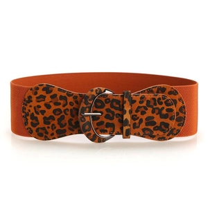 Detail of leopard print elastic waist belt with textured faux leather and metal buckle