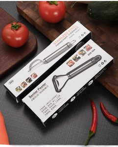 304 stainless steel vegetable peeler in retail packaging with professional kitchen background