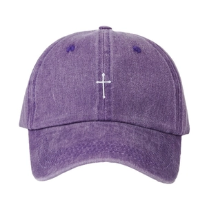 Washed purple baseball cap with white cross embroidery and curved brim for sun protection