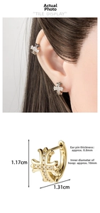 Macro detail of luxury zircon-inlaid cross earring with internal diameter dimensions