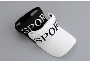 Detail of black and white knitted sport visors with textured fabric and Sport lettering