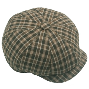 Top view of a vintage brown plaid cotton newsboy cap with classic button detail