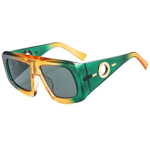 Fashionable square green gradient sunglasses with luxury gold trim on temples