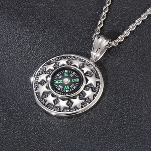 Stainless steel compass necklace with star pattern and black dial on twisted rope chain