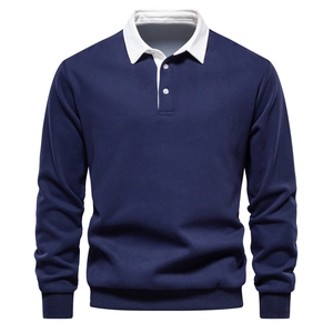 Detail of navy long-sleeve polo shirt featuring a white collar and two-button placket