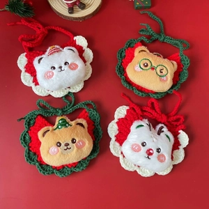 Detail of colorful crochet Christmas pet bibs with cute cartoon animal designs
