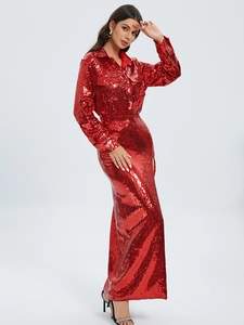 Sparkly red sequin two-piece set featuring a collared long sleeve top and high slit skirt