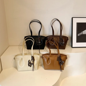Retro pleated Maillard tote bags in four colors with cute cat charms and long handles