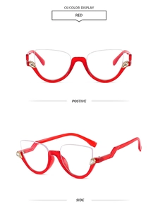 Detail of red cat-eye half-frame glasses with rhinestone accents and geometric temples