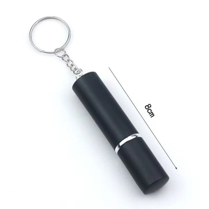 Detail of 8cm matte black portable perfume spray bottle with silver keychain