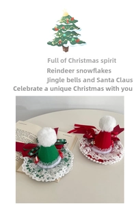 Detail of mini Christmas hat hair clips with lace trim and soft plush pom poms