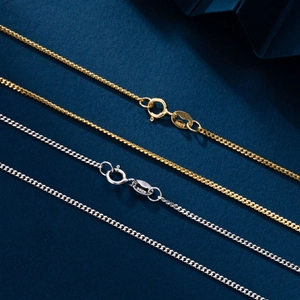 Macro detail of gold and silver S925 sterling silver necklaces with high-polished texture