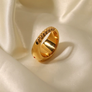 Luxury gold star zircon ring with twisted rope texture on premium silk background