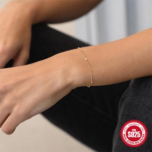 Minimalist S925 sterling silver gold-plated bracelet featuring a single sparkling diamond