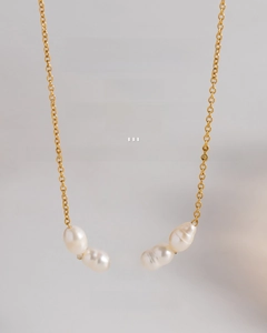 Detail of 18K gold plated stainless steel chain with five white baroque pearls