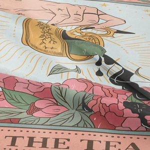 Detailed macro view of the woven fabric texture and THE TEA tarot print on tapestry