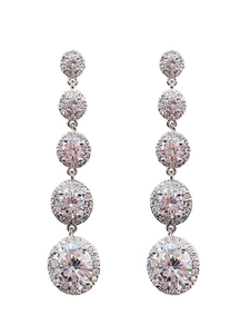 Detail of silver long tassel earrings with five graduated zircon stones on white background