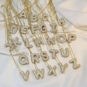 Set of 26 18K gold-plated initial bubble letter necklaces with sparkling zircon stones