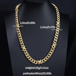 Detail showing 1.6cm width gold thorn cuban link chain dimensions on a black bust