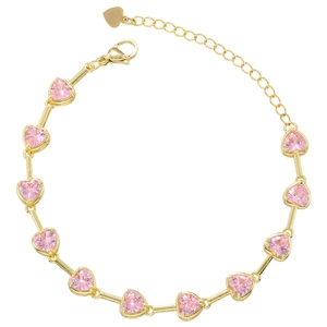 Elegant gold bracelet featuring pink heart-shaped crystals and bamboo node details