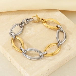 Detail of two-tone gold and silver interlocking oval links bracelet with lobster clasp