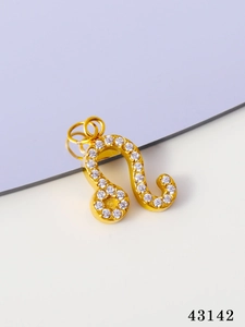 Macro shot of gold plated Leo constellation charm with cubic zirconia for jewelry DIY