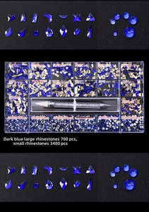 Macro detail of 21-grid nail art set with dark blue crystals and picking pen