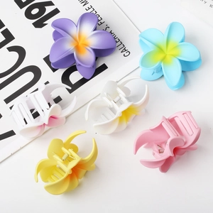 Colorful frangipani flower hair claws for summer beach style in a six-piece set