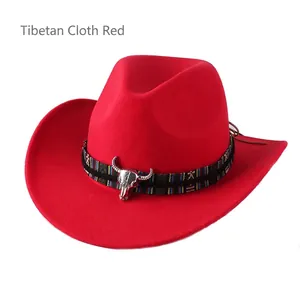 Detail of red cowboy fedora hat featuring ethnic woven band and silver bull head buckle