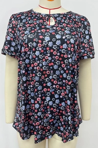 Detail of floral short sleeve top with pink flower print and neckline cutout design