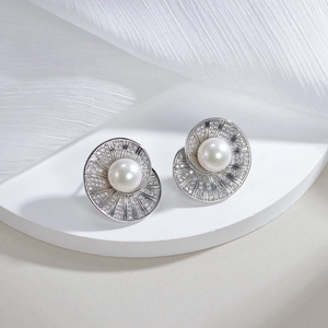 Elegant S925 silver pearl stud earring with spiral diamond halo on white silk backdrop