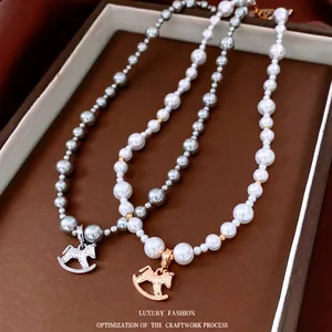 Elegant pearl necklaces with rocking horse pendants in gold and silver finishes