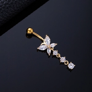 Macro detail of golden butterfly navel ring with marquise and round cubic zirconia crystals