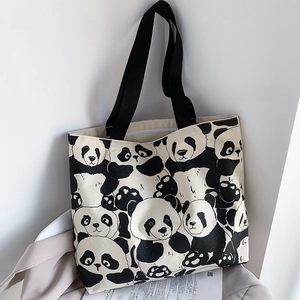 Close-up of cute panda print canvas tote bag with black shoulder straps and zipper