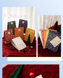 Detail of colorful Christmas paper gift bags with festive patterns and sealing stickers