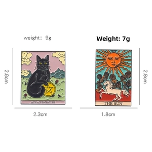 Detailed tarot enamel pins showing Ace of Pentacles and Sun designs with dimensions