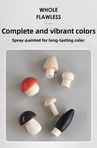 Detail of creative painted wooden mushroom ornaments in various natural shapes and colors