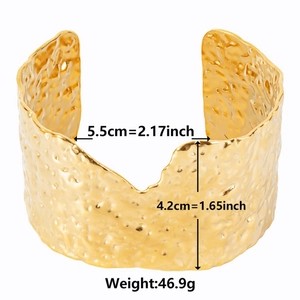 Detailed view of wide 18k gold plated stainless steel cuff with hammered texture