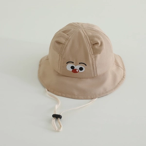 Detail of baby sun hat with cute bird embroidery and adjustable windproof strap