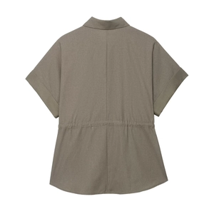 Detailed view of women's short-sleeved shirt with elastic waist and fine fabric texture