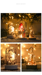Détail d'un dôme de Noël en verre avec lumières LED et décor de cabane d'hiver nordique