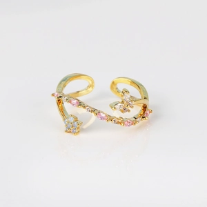 Golden open ring with flower and butterfly charms plus sparkling pink crystals